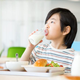 Child drinking milk at school lunch